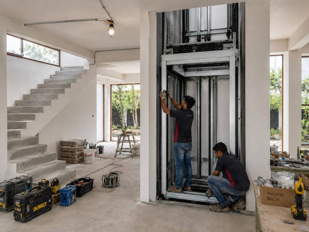 Residential platform lift being installed on site during construction